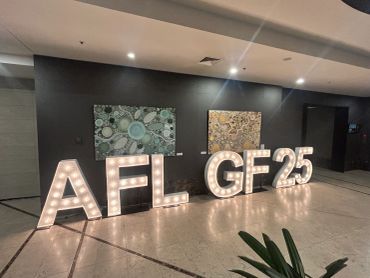 Illuminated AFL GF 25 sign indoors.