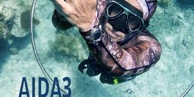 Freediver underwater with AIDA3 text.