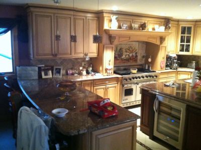 Cozy kitchen with wooden cabinets and granite countertops.