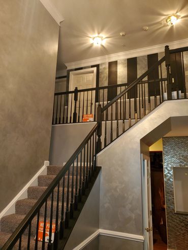  Silver Metallic walls, Handrails from oak to Black, Accent wall is Black and Metallic Gold finish!