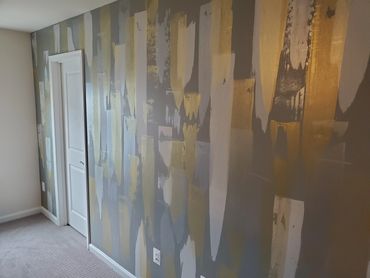Accent wall done in light, dark grey with Gold and Silver Metallic finishes!