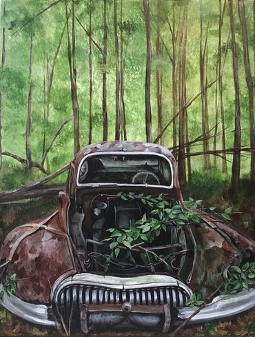 An old rusted car overtaken by nature in a dense forest.