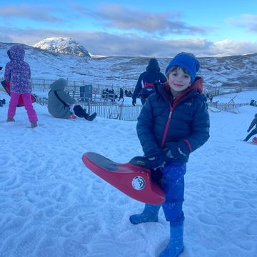 Sledging up the mountain ski lift at Glen Coe