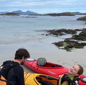 Kayaking looking out to the Inner Hebrides on white sand beaches 