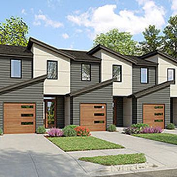 Modern townhouses with wooden garage doors and slanted roofs.