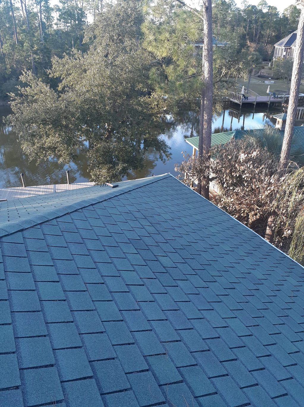 gray shingles on roof of home.