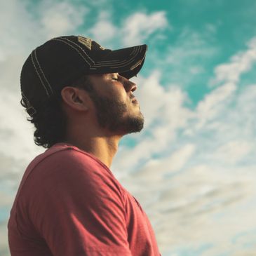 Man sitting and engaging in mindfulness practices.