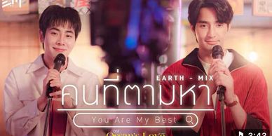 Two men holding microphones with a warm, colorful background and Thai text.