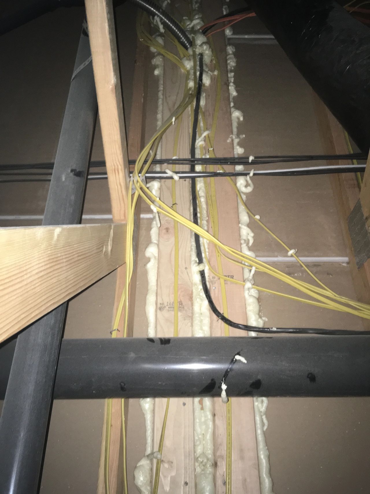 Canned spray foam in attic along interior partition walls