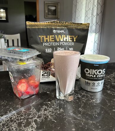 Strawberry protein shake with whey powder and Greek yogurt.