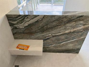 A picture of a grey designed tile with a window