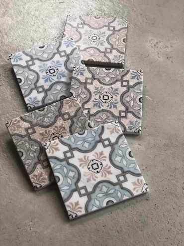 A picture of unique deigned tiles on the floor