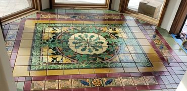 A picture of a tile designed floor on the balcony 