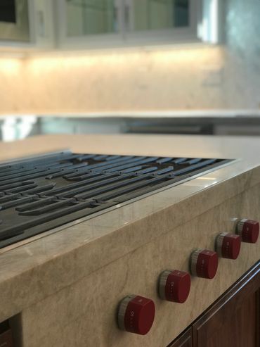 A close up picture of a fire stove in the kitchen