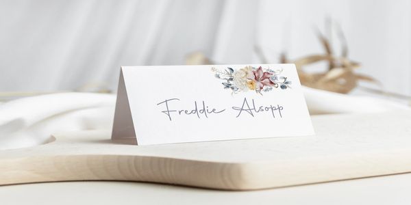 Name card reading Freddie Alsopp with floral design.