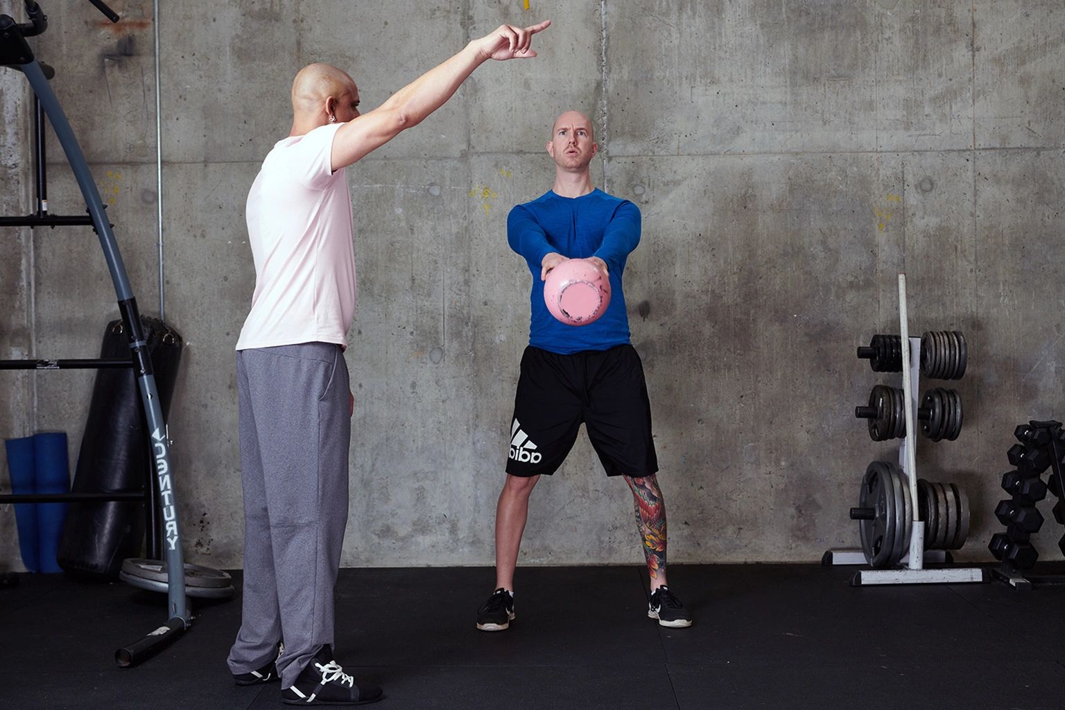 Vancouver Personal Trainer working with his client in the gym.