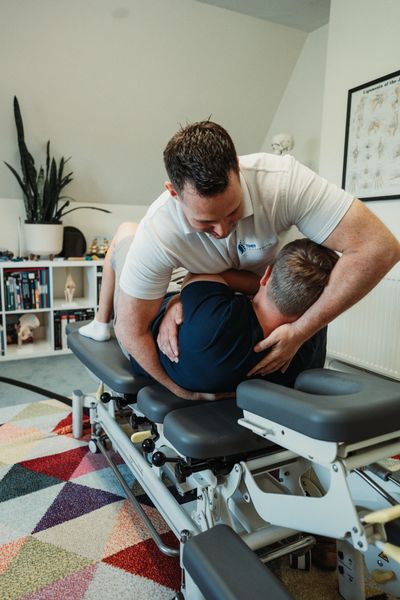 Chiropractor providing hands-on treatment to help relieve sciatica pain in Tenby, Pembrokeshire