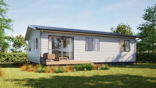 Small modern house with patio and lawn.