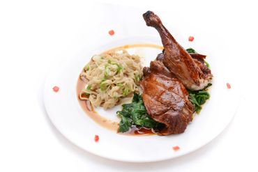 A plate of pasta and chicken roast 