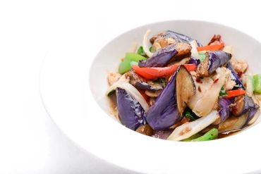 A Bowl With Sea Food And Vegetables