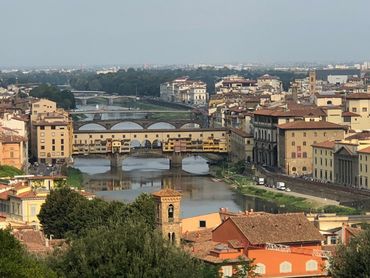 View of the Ponte Vecchio bridge over the Arno River in Florence, Italy.