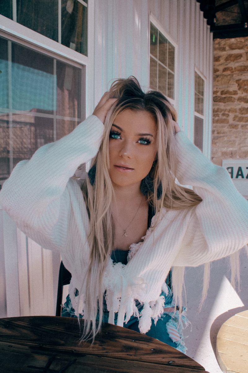 distressed tie sweater
