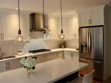 White Shaker Doors with Gold Accent Handles and Light Fixtures.