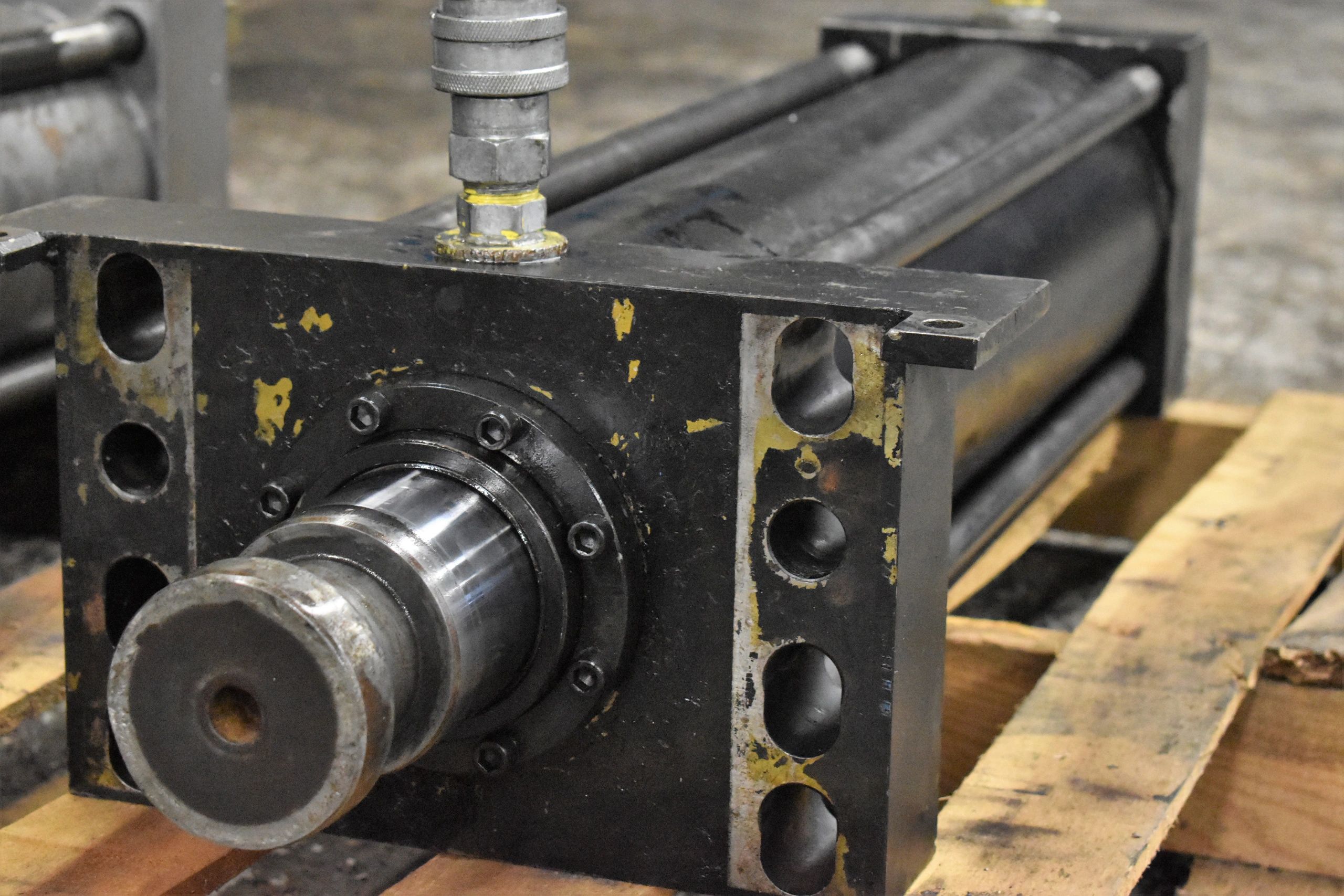 Hydraulic cylinder with wear and damage being prepared for inspection, repair, or rebuilding.