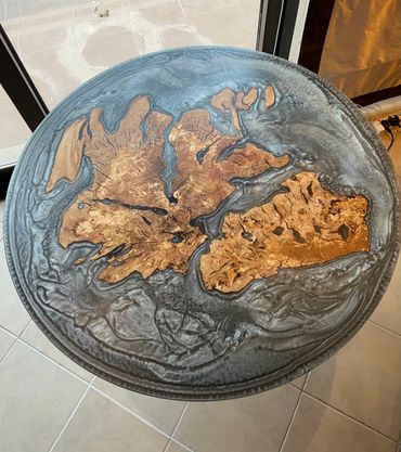 Round table with artistic wood and resin design.