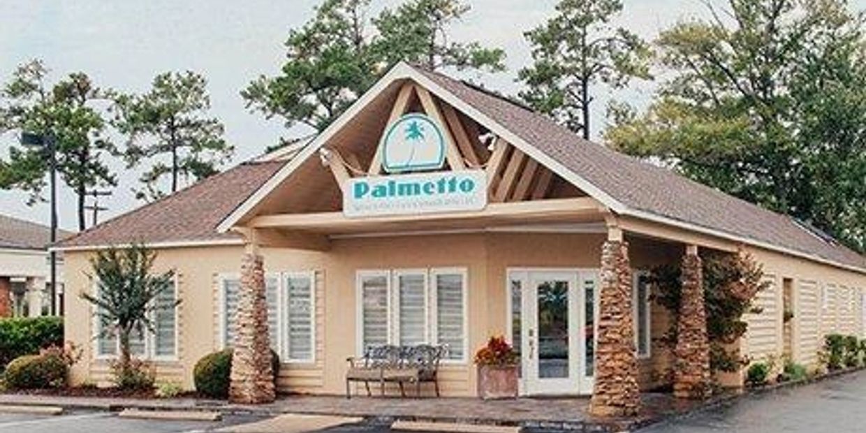 Exterior view of Palmetto Assisted Living and Memory Care building.