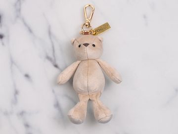 Milky white teddy charm