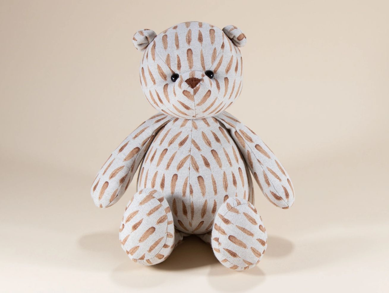 Brown feather pattern teddy bear