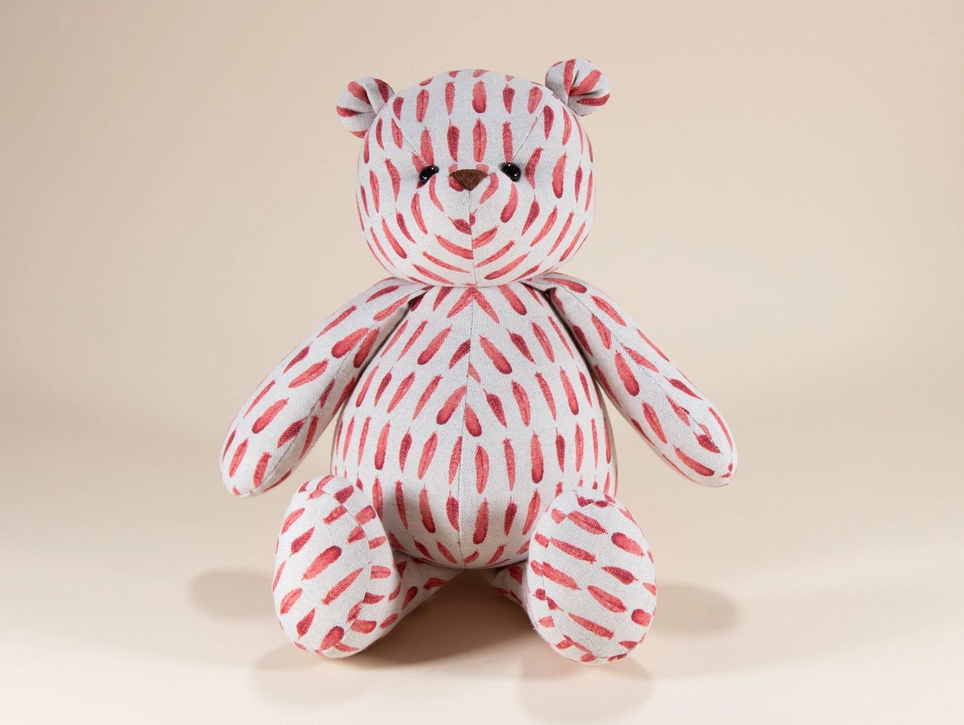 Red feather pattern teddy bear