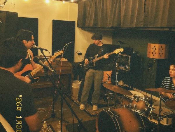 Band rehearsing in a cozy room.