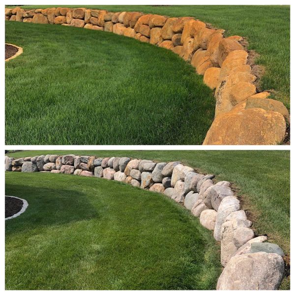 Before and after rust stain removal on boulder wall