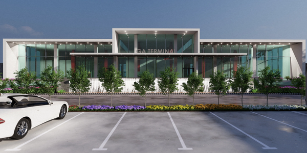 Modern glass terminal building with a white convertible car parked outside.