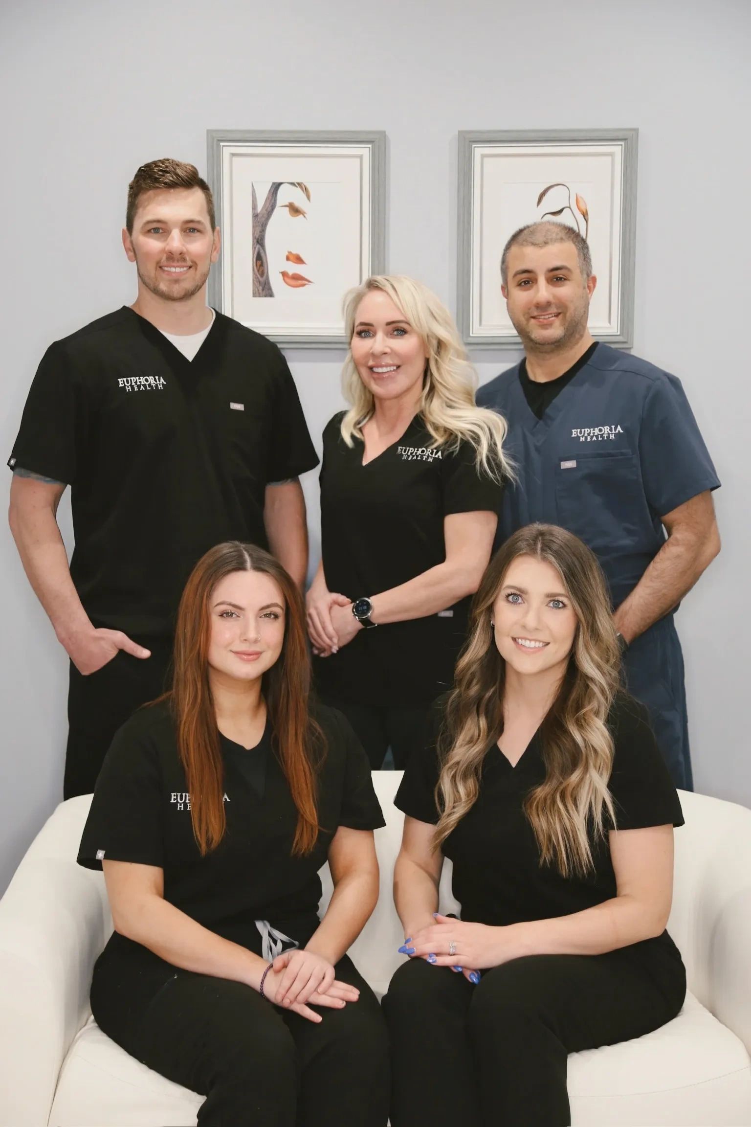 Group of medical aesthetic professionals smiling.