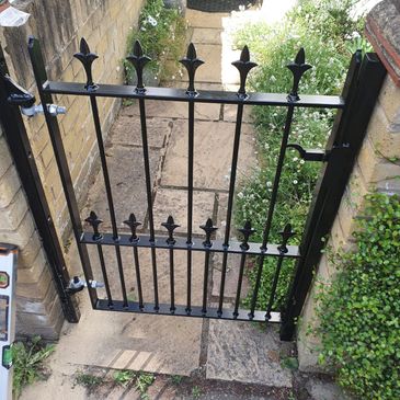 Black metal pedestrian gates London professionally installed for secure property access