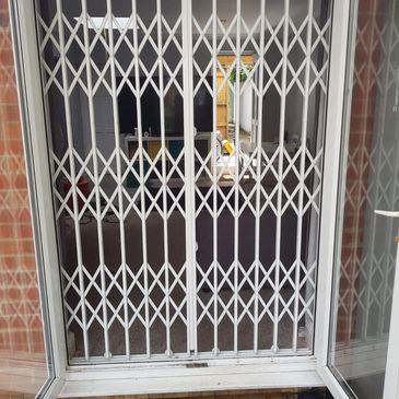 Bespoke collapsible gates London installed for secure shopfront and commercial property access