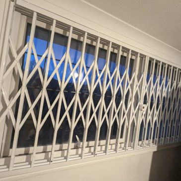 Concertina collapsible gates Hayes installed for warehouses, shops and business premises
