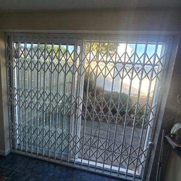 Retractable collapsible gates Stanmore built for strong commercial and residential security