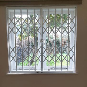Bespoke collapsible security gates London fitted for residential and commercial entrances