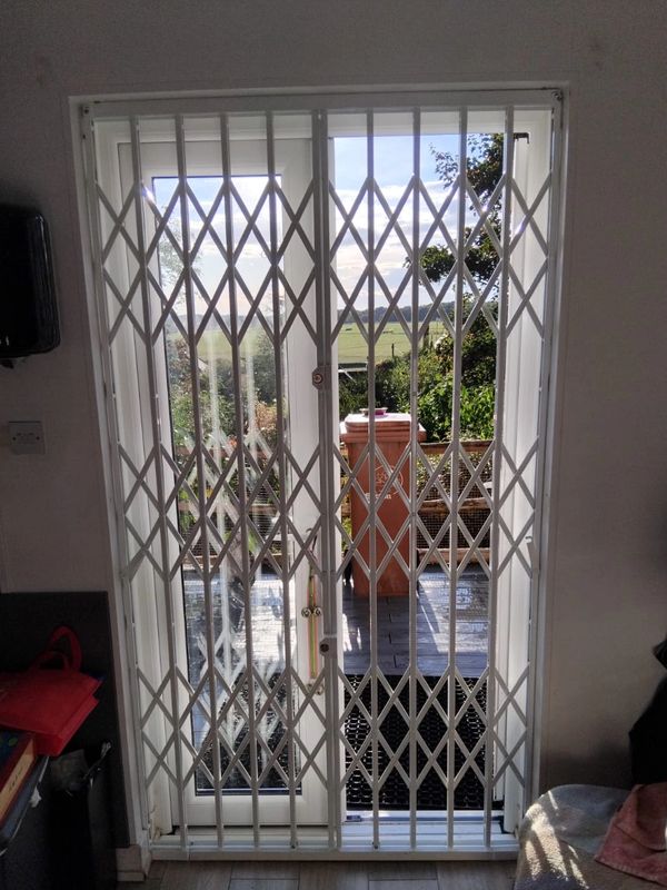 Retractable collapsible gates London installed for shops, warehouses and secure access points