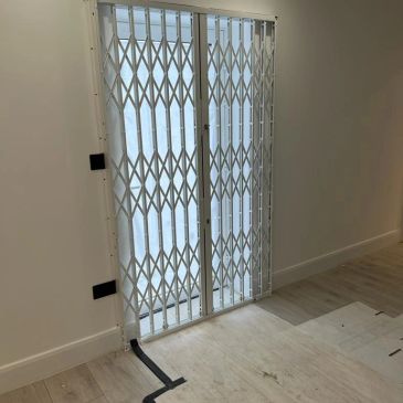 Collapsible security gates Hayes installed for residential and commercial property protection