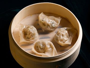 Steamed wonton filled w. minced pork, dried shrimp, dried tofu, bamboo shoots, yard long bean, sour picked vegetables, garlic-seedling