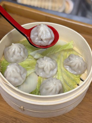 Our Pork Soup Dumplings are a mouthwatering experience, packed with juicy flavor in every bite. Each