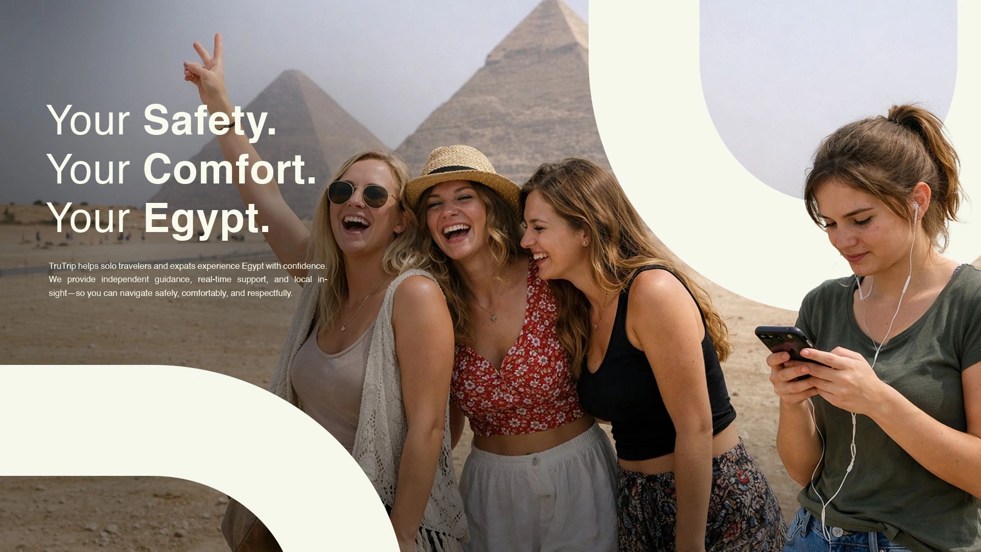 Four young women enjoying their trip near the Egyptian pyramids, embracing comfort and safety.