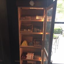 A large custom humidor at a property that is partnered with Fumar Cigars TX