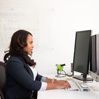 woman typing on computer