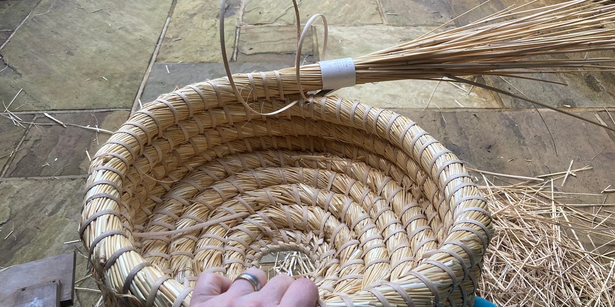 Skep making. A traditional straw beehive